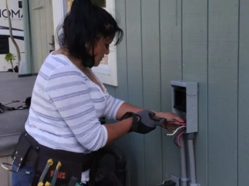 Licensed electrician wiring an exterior subpanel in Hainesville