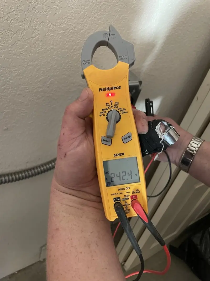 Voltage testing with clamp meter during Electrical Installation Services in Hainesville